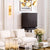 Eichholtz glass-front cabinet with brass detailing showcasing décor pieces in an elegant modern living room.