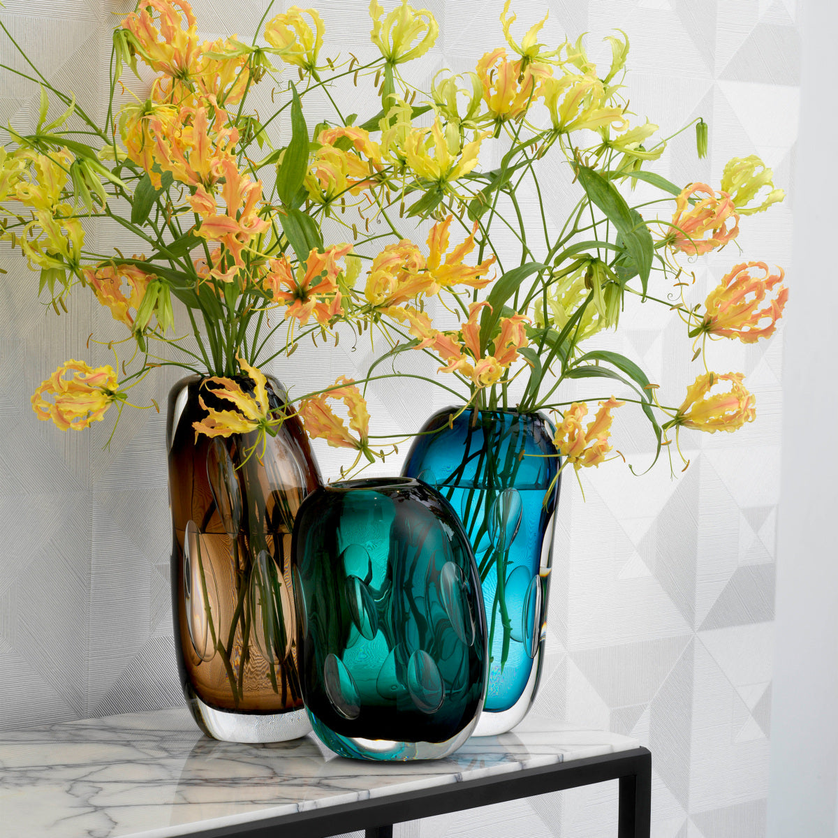 Eichholtz Vase Sianni S flowers. The extraordinary shape with enclosed air bubbles makes this green glass vase a real
