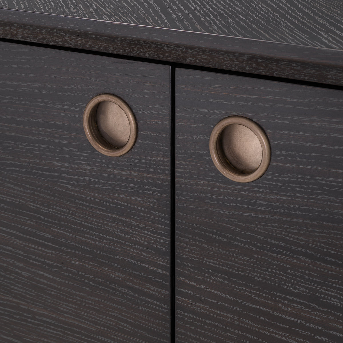 Eichholtz Dresser Premier charcoal grey oak veneer With its charcoal oak veneer casing and medium bronze finish frame and hardware, Dresser Premier is