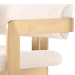 Eichholtz Chair Donato brushed brass finish bouclé cream Architectural design meets luxe materials in the statement Donato Chair. Cream bouclé wraps around