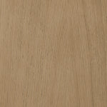 Close-up of a wooden surface with a light brown color and visible grain pattern.
