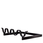 Eichholtz Andiron Barlieu sturdy metal firedog is provided with a black finish. The waved bar at the front