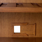 Eichholtz Bar Cabinet Borchard modernity. Adorned with exquisite rattan paneling, this high-end piece captures timeless style, making it a