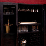 Eichholtz Bar Cabinet Connaught and accented by a luxurious bronze finish, this piece exudes elegance. With two clear glass
