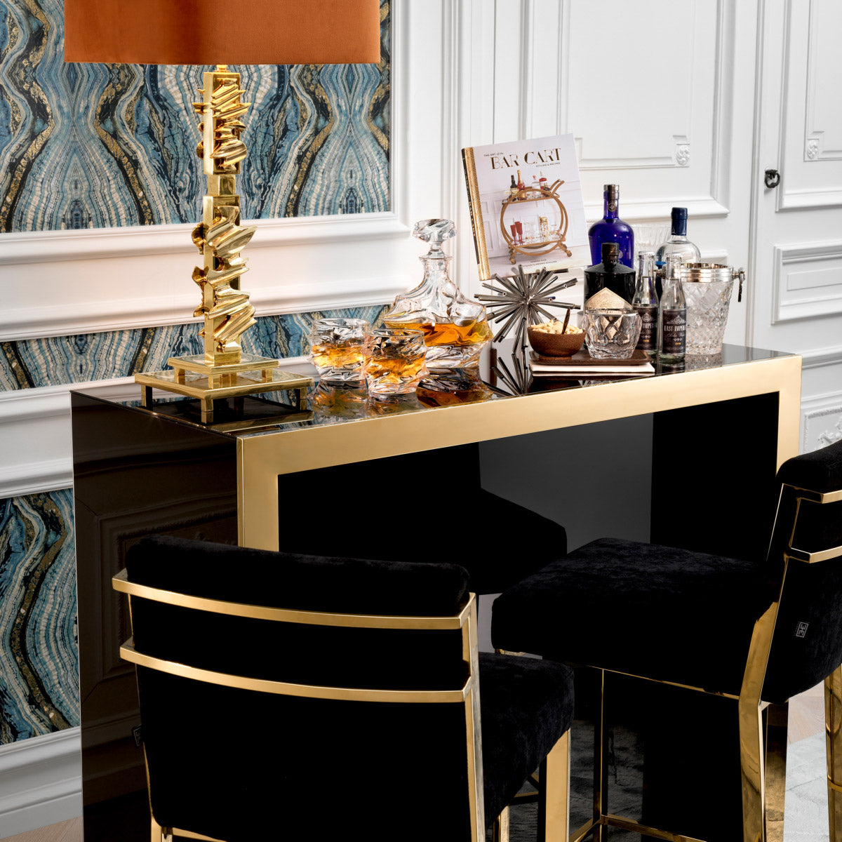 Eichholtz Bar Grimaldi with the ultra-stylish Grimaldi Bar. Featuring a black glass exterior with a gold finished frame,