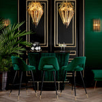 Eichholtz Bar Stool Avorio green velvet upholstered seat with button back and black tapered legs with brass caps, this