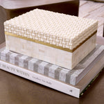 Eichholtz Box Seaside S in the mixed patterns handcrafted onto the cream colored resin. Discover a luxurious storage solution