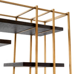 Eichholtz Cabinet Ward casing has a brushed brass finish and contains free flowing oak veneer shelves in charcoal
