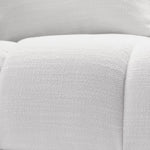 Eichholtz Chair Aurelio With its deep-buttoned Avalon white upholstery and tapered black legs it adds sophistication to any .