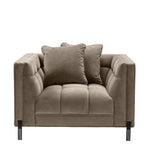 Eichholtz Chair Sienna whole with the armrests. This elegant modern armchair comes in a tufted upholstery in mellow