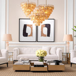 Eichholtz Chandelier Benini L chandelier with antique brass finish features diamond-shaped tubes of amber glass that let light fall
