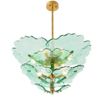 Eichholtz Chandelier Florina finish beautifully frames the handcrafted green glass, offering an organic aesthetic that elevates any space.