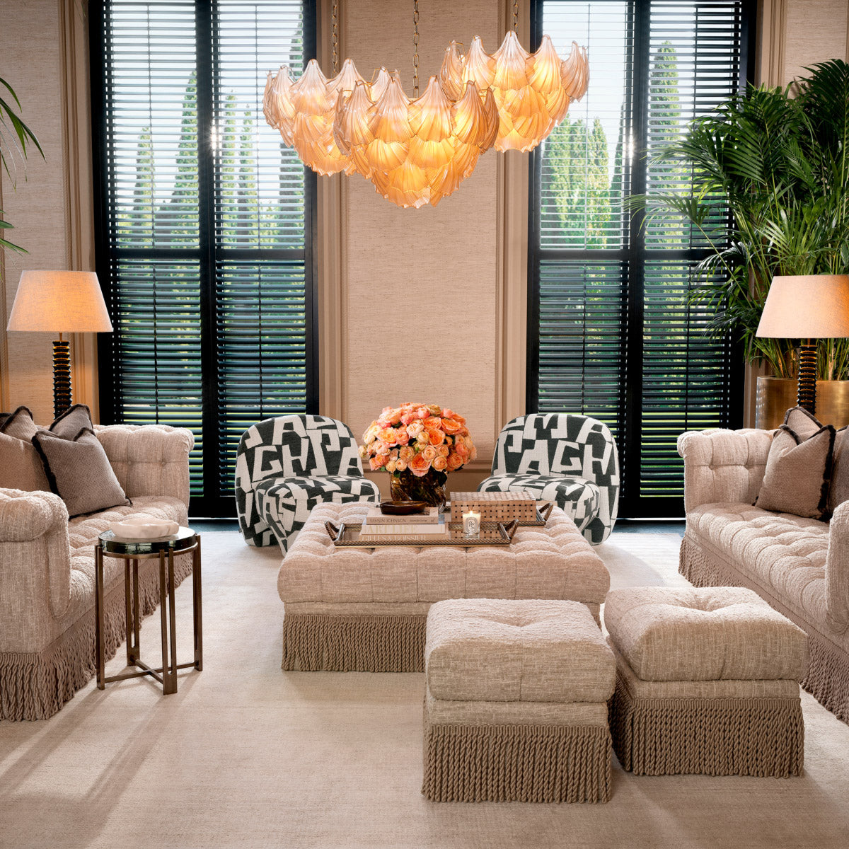 Eichholtz Chandelier Ibiza inspiration and modern luxury. Crafted from champagne-colored glass and antique brass, this iconic piece exudes