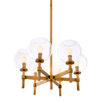 Eichholtz Chandelier Jade S direction. Clear glass globe shades disperse the light from the bulbs (not included) throughout your