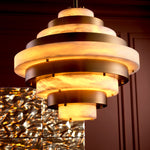 Eichholtz Chandelier Lazzari of materials, showcasing alabaster disks set against antique brass, offers a warm, diffuse glow that