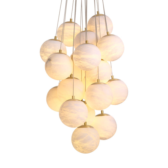 Eichholtz Chandelier Sphinx L Illuminate your decor with the Chandelier Sphinx L, where antique brass meets the celestial beauty
