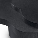 Eichholtz Coffee Table Cesareo by Eichholtz is a paragon of modern design, with its organic shaped charcoal grey oak