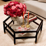 Eichholtz Coffee Table Cornelius with antique brass feet. Its dual layers of bevelled glass offer both style and functionality,