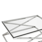 Eichholtz Coffee Table Criss Cross with a rectangular clear glass tabletop. Coffee Table Criss Cross Crafted by Eichholtz this coffee