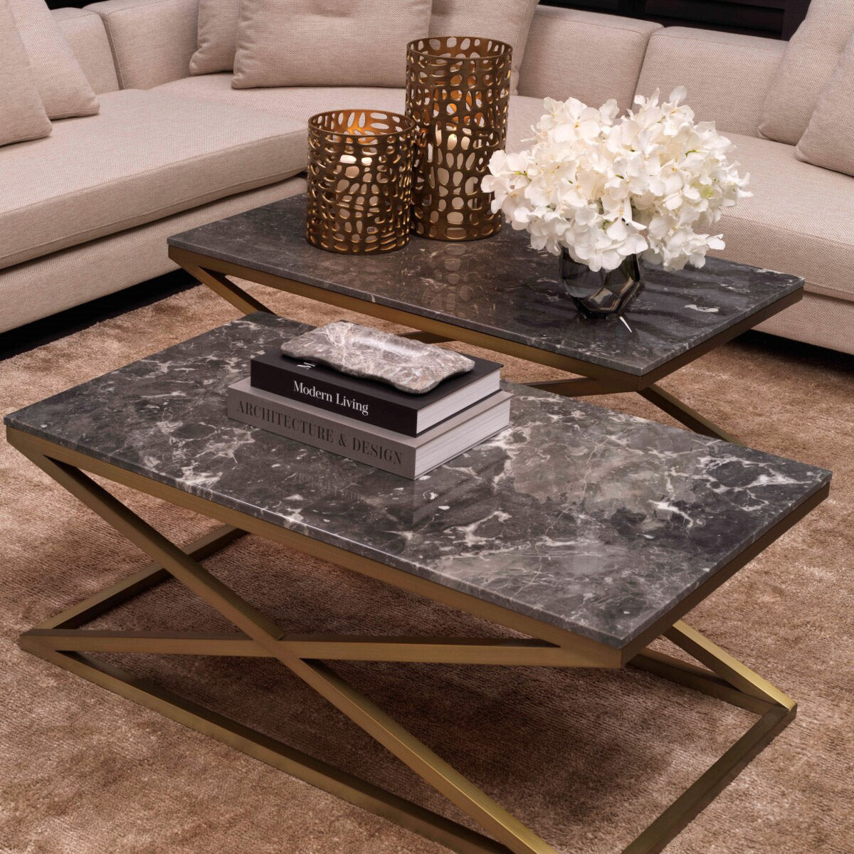Eichholtz Coffee Table Criss Cross furniture piece has a brushed brass finish X-frame and a grey marble tabletop. Coffee Table
