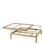 Eichholtz Coffee Table Harvey decorative items. Comprising a stainless steel frame with a brushed brass finish, it features a