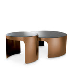 Eichholtz Coffee Table Piemonte set of 2 of bevelled black glass and a metal base in a brushed copper finish, they will