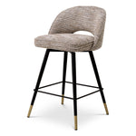 Eichholtz Counter Stool Cliff set. Featuring black tapered legs with gold caps and a Mademoiselle beige upholstery, each counter