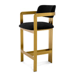 Eichholtz Counter Stool Donato a circular seat and curved backrest in a Bouclé black upholstery, this counter stool pairs