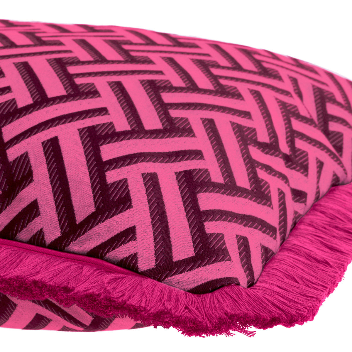 Eichholtz Cushion Doris L accentuated by dark pink fringe accents. The vibrant pink Doris print on a white backdrop