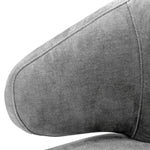 Eichholtz Dining Chair Cardinale and tapered legs feature a Clarck grey upholstery and give this eye-catching armchair a sense