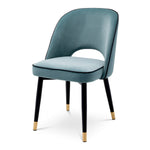 Eichholtz Dining Chair Cliff open at the bottom before the seat. Its stylish silhouette is accentuated with black faux