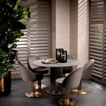 Eichholtz Dining Chair Dorland brass finish and Roche dark grey velvet upholstery, this iconic piece seamlessly blends metal and