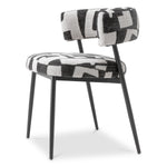 Eichholtz Dining Chair Folsom craftsmanship, this iconic piece features bold Brooklyn black fabric and sleek black legs. The combination