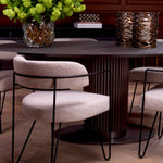 Eichholtz Dining Chair Giuseppe and contemporary edge. This piece, with its contrasting black legs and Bouclé chalk white fabric,