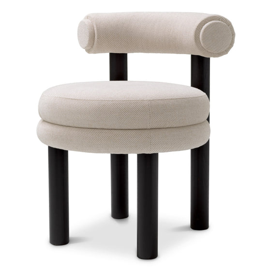 Eichholtz Dining Chair Zoey Experience the allure of the Eichholtz Zoey Dining Chair, a harmonious blend of artisan craftsmanship