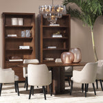 Eichholtz Dining Table Westwood distinctive central leg, crafted from four elegant columns, adds a bold architectural element. The rich