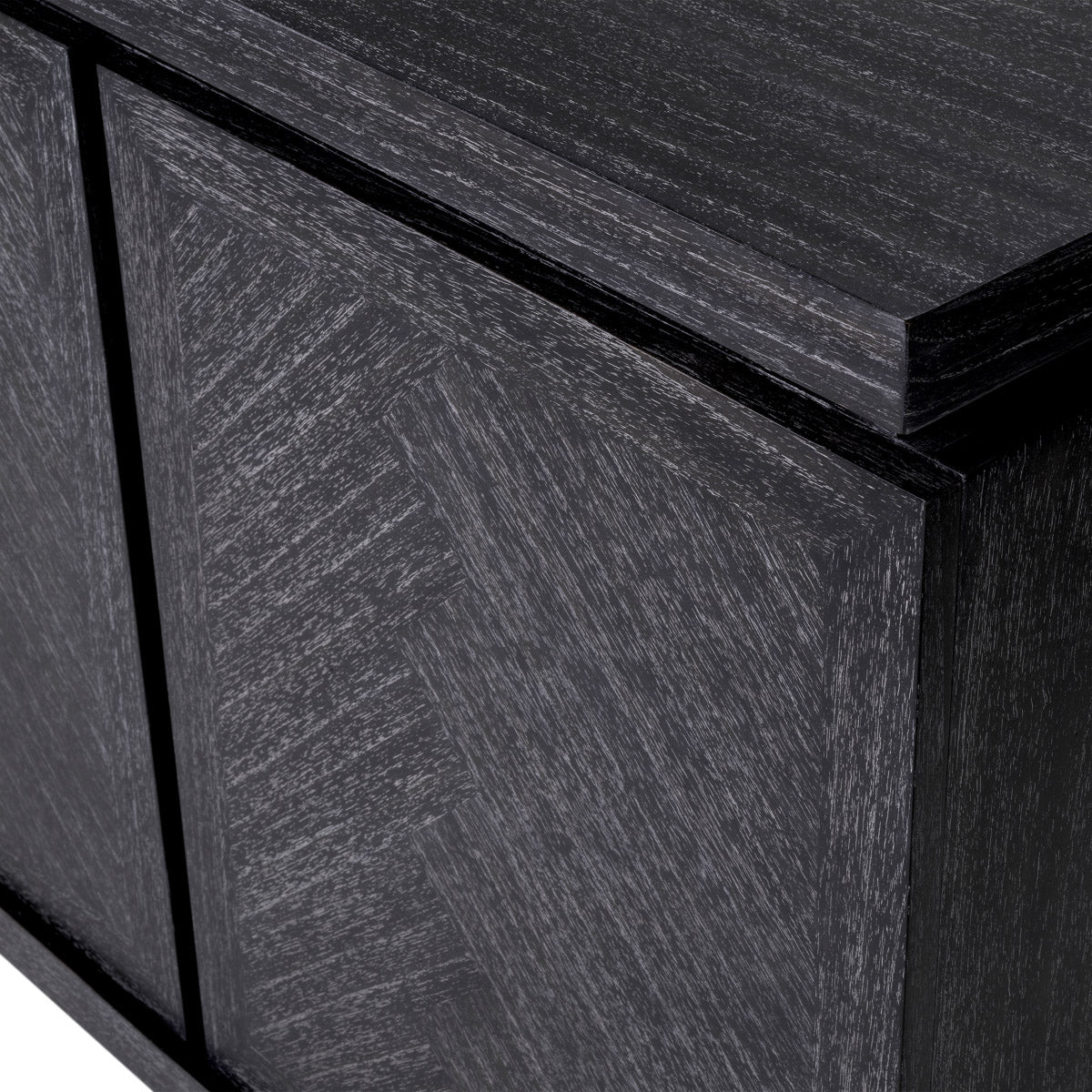 Eichholtz Dresser Bowen has four handle-less doors that leave a graceful impression with their refined herringbone patterns. Dresser