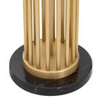 Eichholtz Floor Lamp Condo an antique brass finish. The fixture comes complete with a round black drum shade with