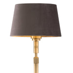 Eichholtz Floor Lamp Tryon decor. With its brushed-brass finishing, an adjustable height feature, and a grey velvet shade, handmade