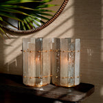 Eichholtz Hurricane Greyson features a vintage brass finish and a hand-blown glass shade in a captivating grey hue.