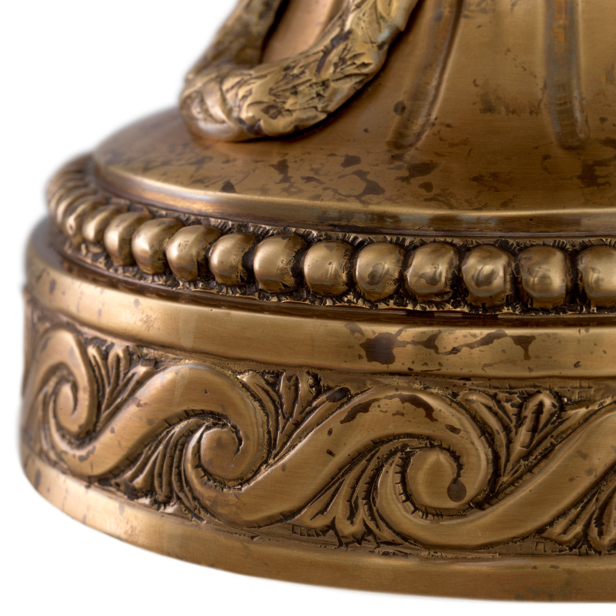 Eichholtz Hurricane Vitruvian is crafted from gilt bronze and bears a glass shade for practical protection from drafts.