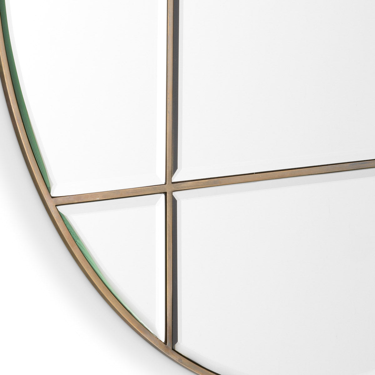 Eichholtz Mirror Beaumont round design segments the bevelled mirror glass, breaking up the reflective plane and enhancing the traditional
