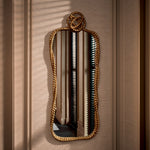 Eichholtz Mirror Vincenso L features a design that evokes the charm of a twisted rope with a knot, adding