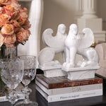 Eichholtz Object Sphinx set of 2 from white marble with meticulous handwork, each piece is unique, marked by variations in color