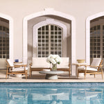 Eichholtz Outdoor Coffee Table Cleon indoor space. Crafted with glass fibre reinforced concrete, the table boasts a matte dry look