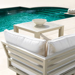 Eichholtz Outdoor Coffee Table Vistamar with decorative slits and a sand finish, this luxurious coffee table will add a stylish