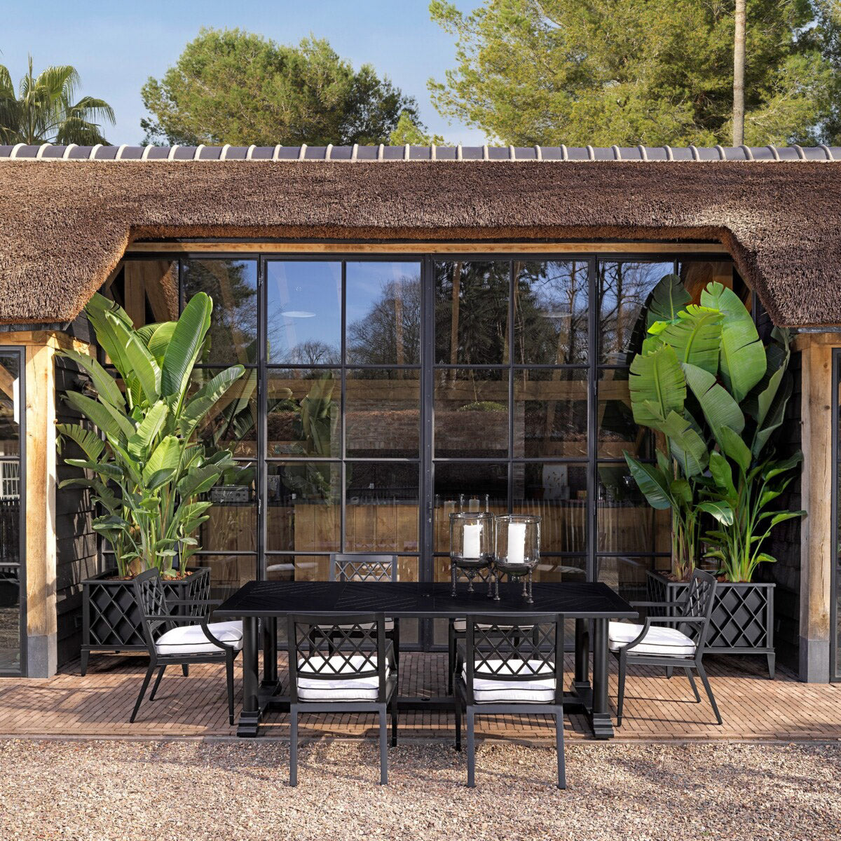 Eichholtz Outdoor Dining Table Bell Rive conservatory, veranda, patio or garden. With its sophisticated look and matte black finish frame...