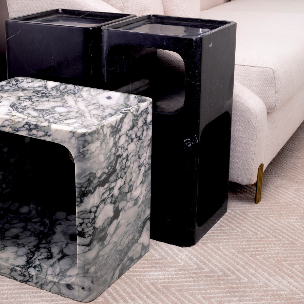 Eichholtz Side Table Adler Mid-Century Modern style and is comprised of black marble, making each table unique. Side Table