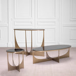 Eichholtz Side Table Elegance a stunning brushed brass finish and a bevelled black glass top, the table is sleek,