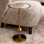 Eichholtz Side Table Narciso This stylish accent table sits on one leg and comes in a brushed brass finish.